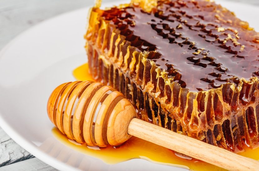 honeycomb-on-plate-with-honey-dipper.jpg